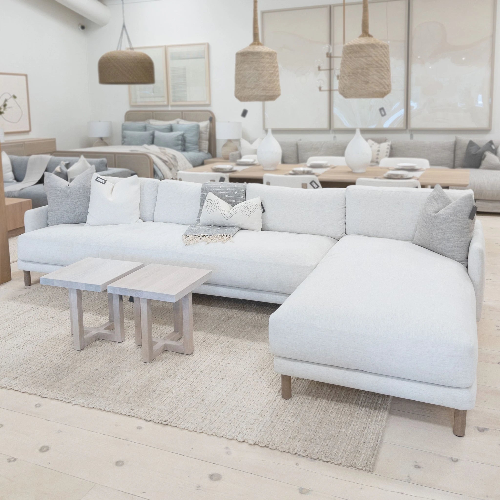 As Shown: in right chaise upholstered in Nomad Snow, oak legs finished in Antique Beige (Discontinued Finish)