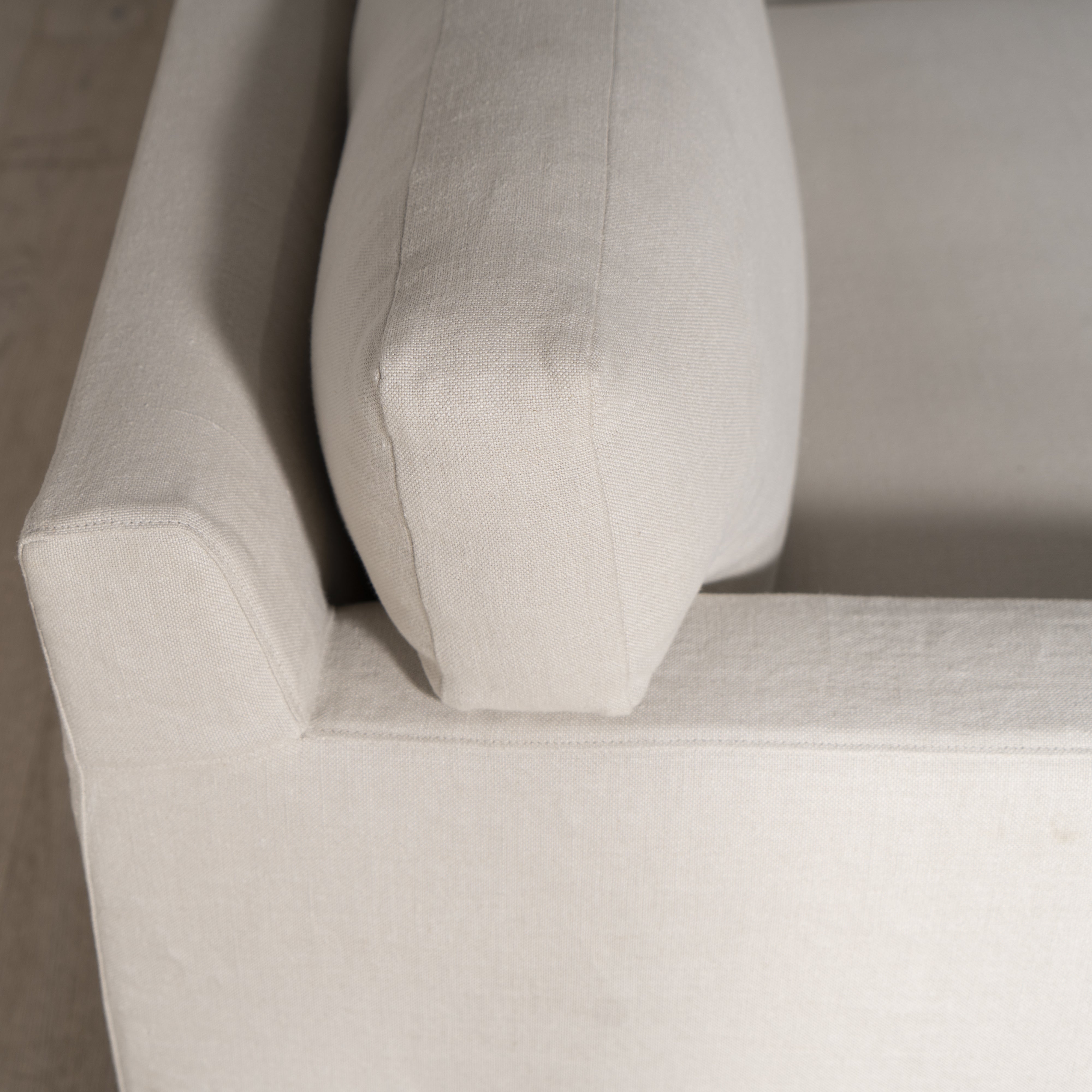 As Shown: in Large, short slipcovered in Fresno Sand, oak legs in custom finish