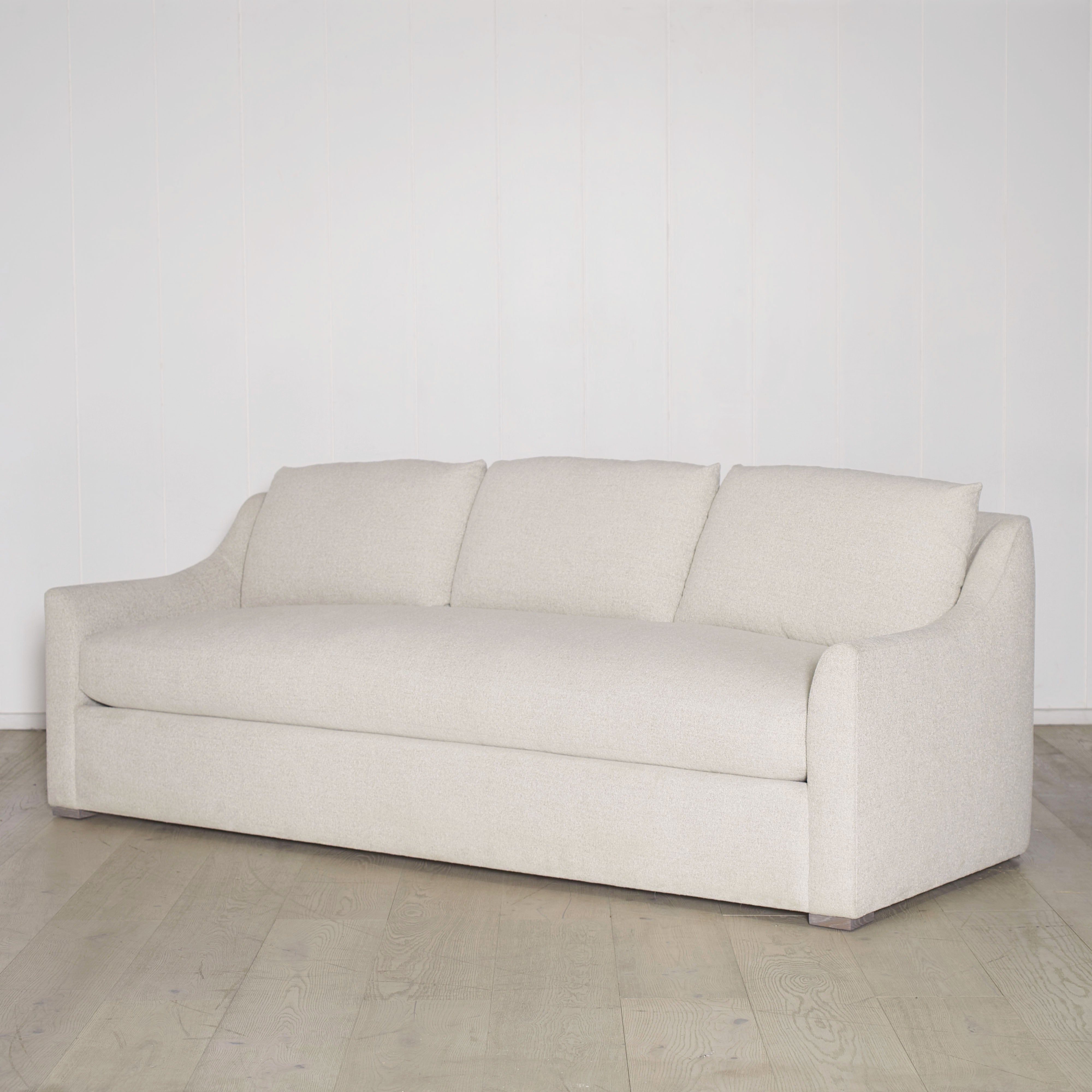 As Shown: Slipcovered in COM with a 3 over 1 Cushion Configuration