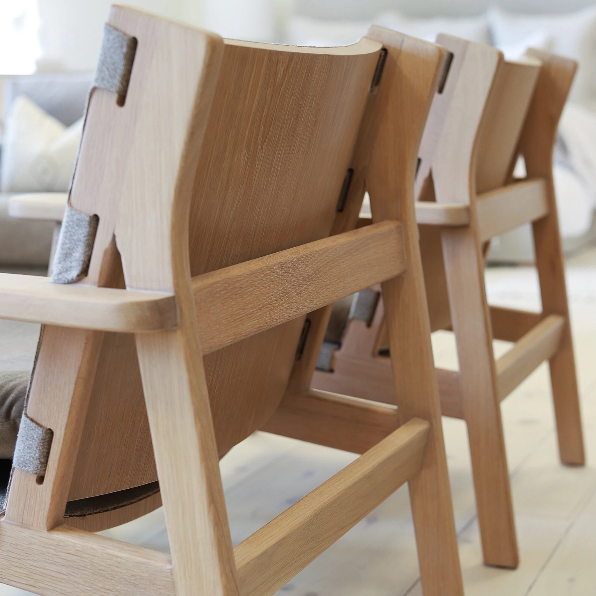 As Shown: in COM and Sky Taupe cushion.Oak finished in Mint White Natural.