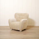 As shown upholstered in Canyon Sand, legs in Sand finish
