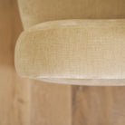 As shown upholstered in Canyon Sand, legs in Sand finish