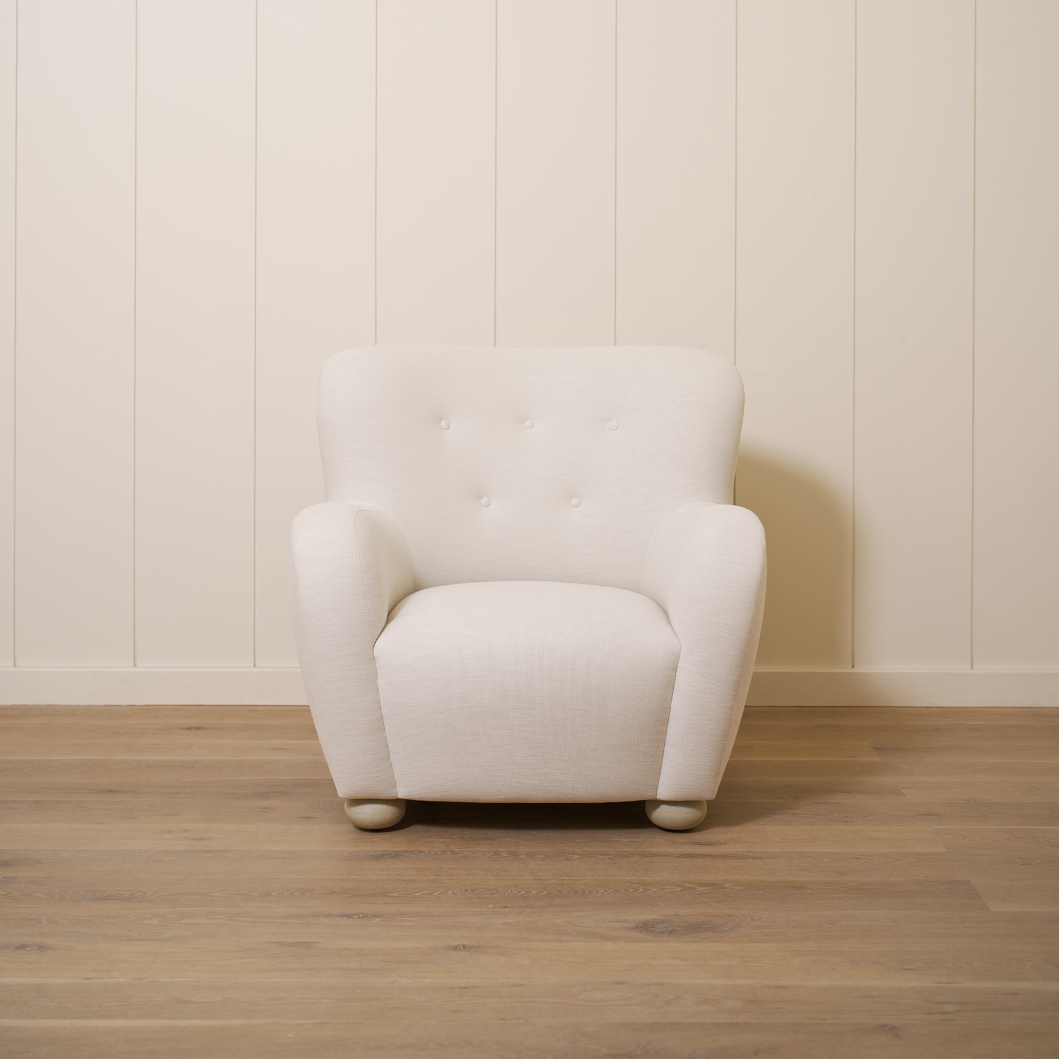 As shown upholstered in Vail Oyster, legs in Sand finish