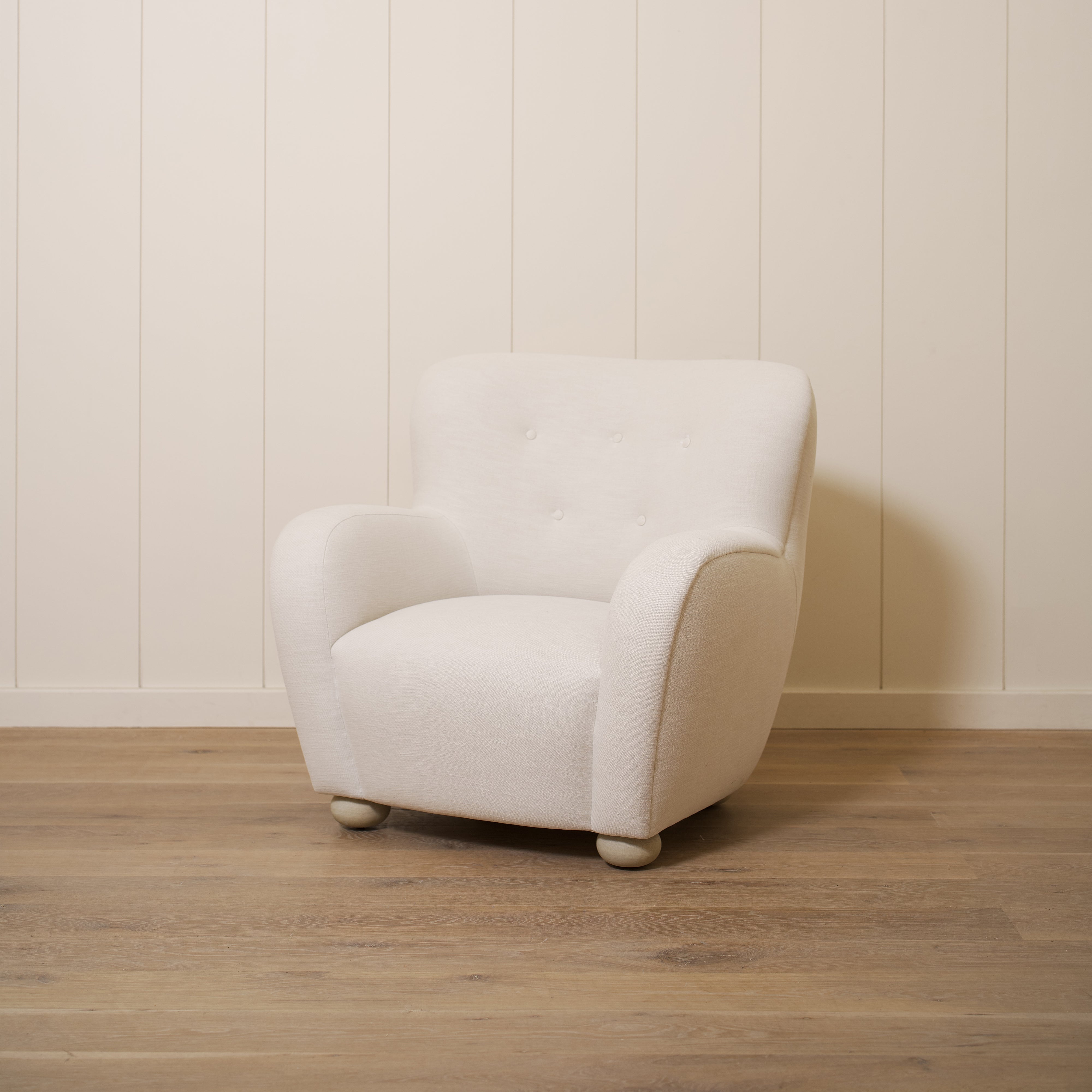 As shown upholstered in Vail Oyster, legs in Sand finish