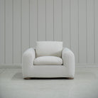 As Shown in Slipcovered Fresno Sand, Oak Round Legs finished in Cashmere Brown (Discontinued Finish)