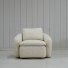 As Shown: in Berber Natural, swivel finished in Mint White Natural.