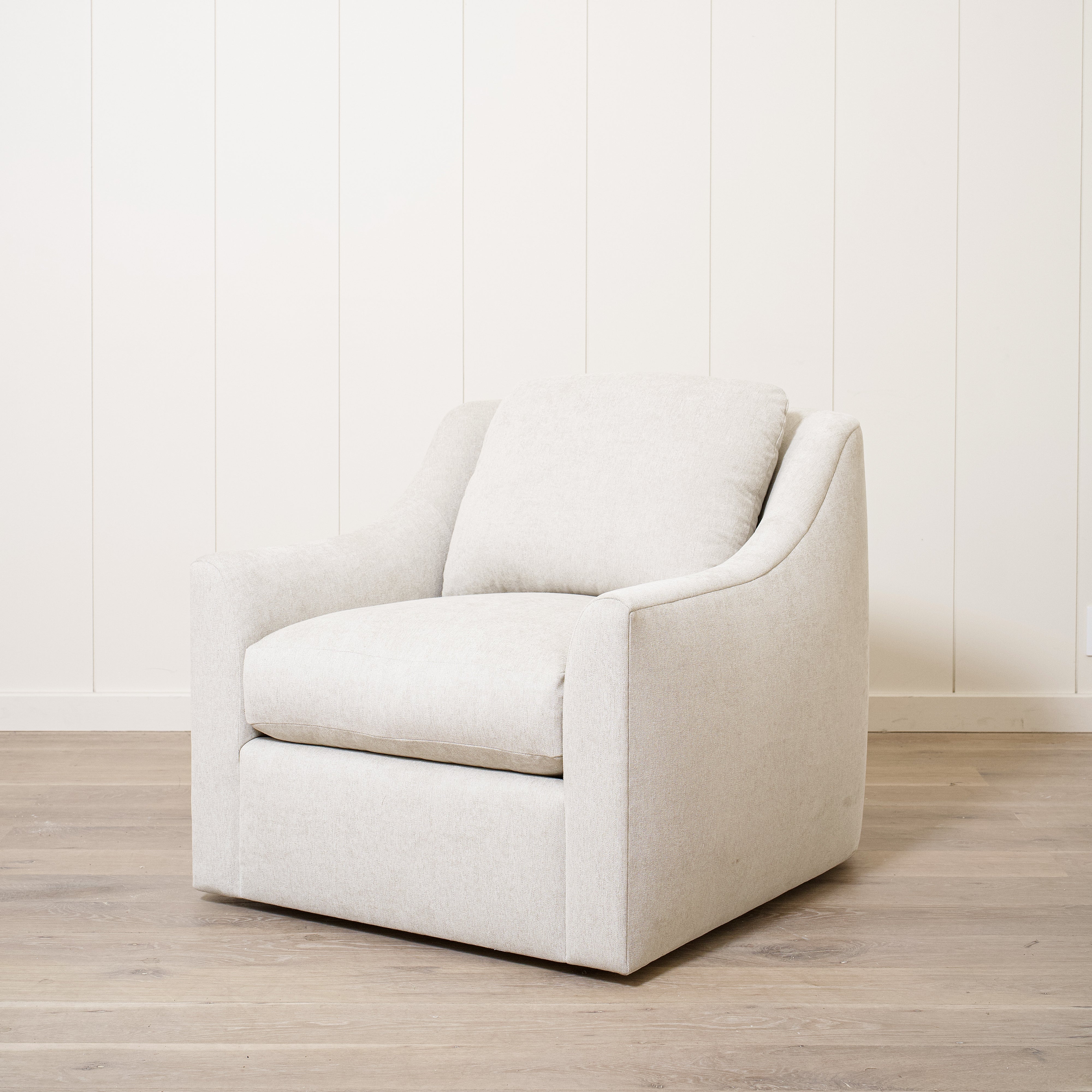 As Shown: Upholstered in Marion Natural, swivel.