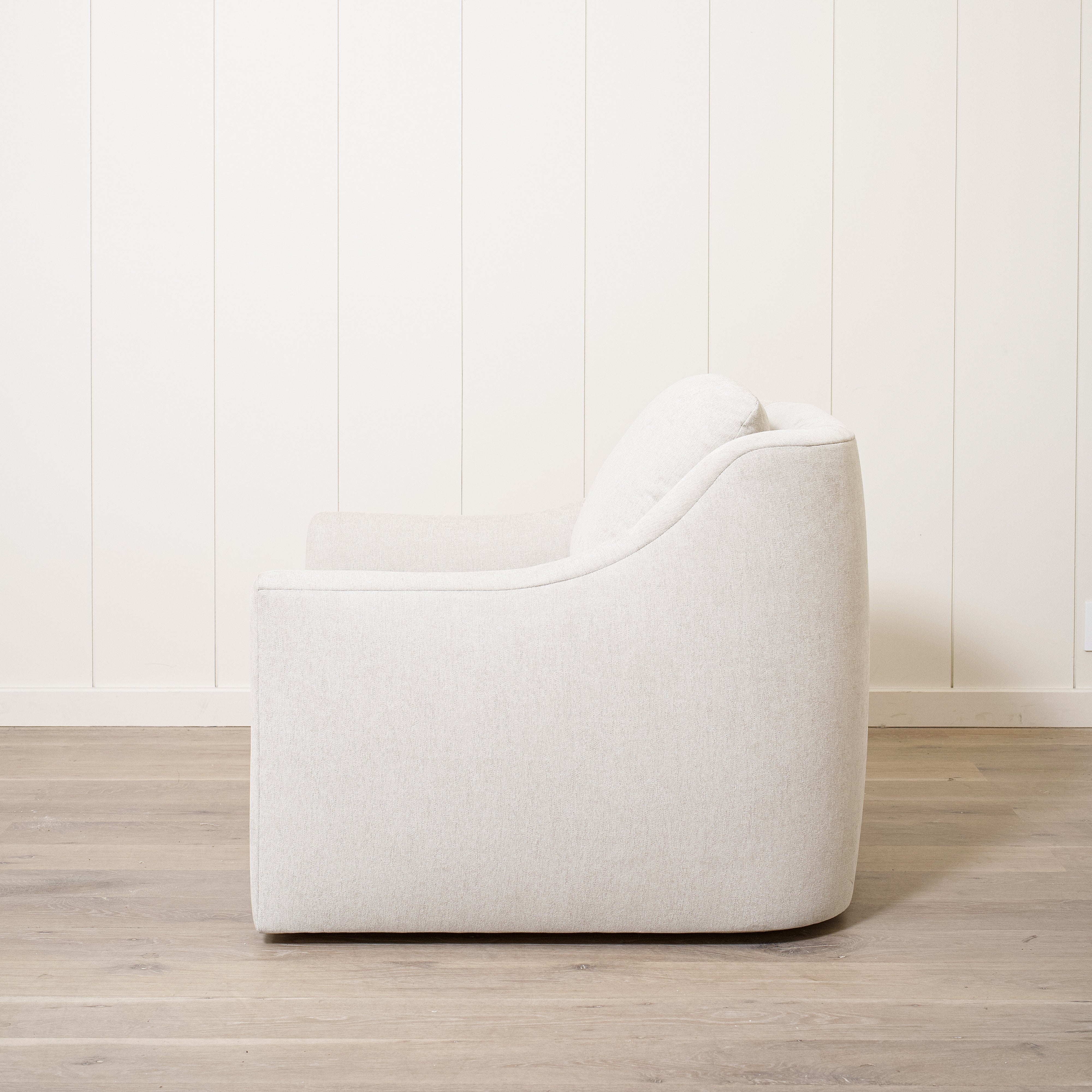As Shown: Upholstered in Marion Natural, swivel.