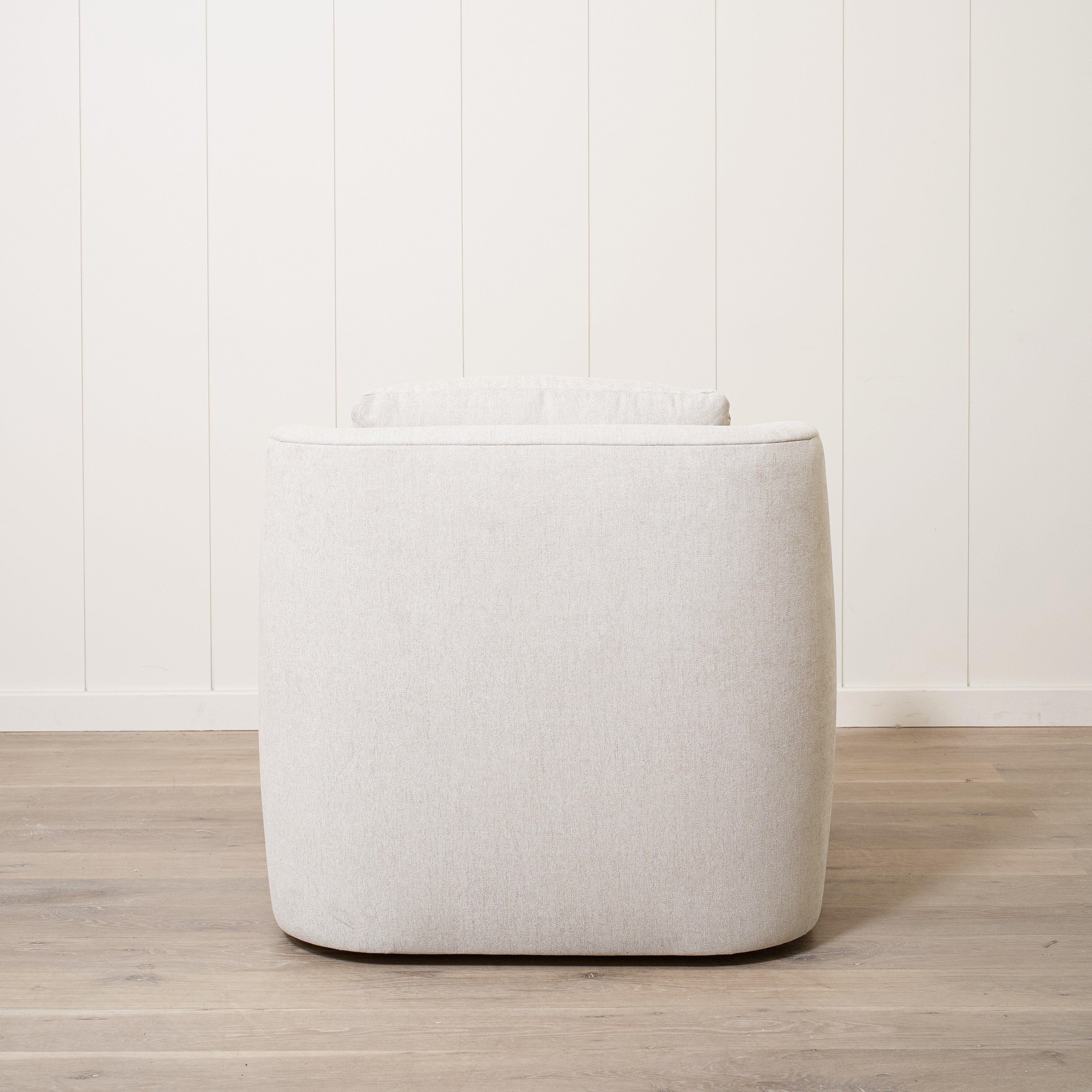 As Shown: Upholstered in Marion Natural, swivel.