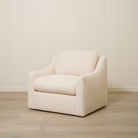As Shown: Upholstered in Teddy Ivory, swivel.