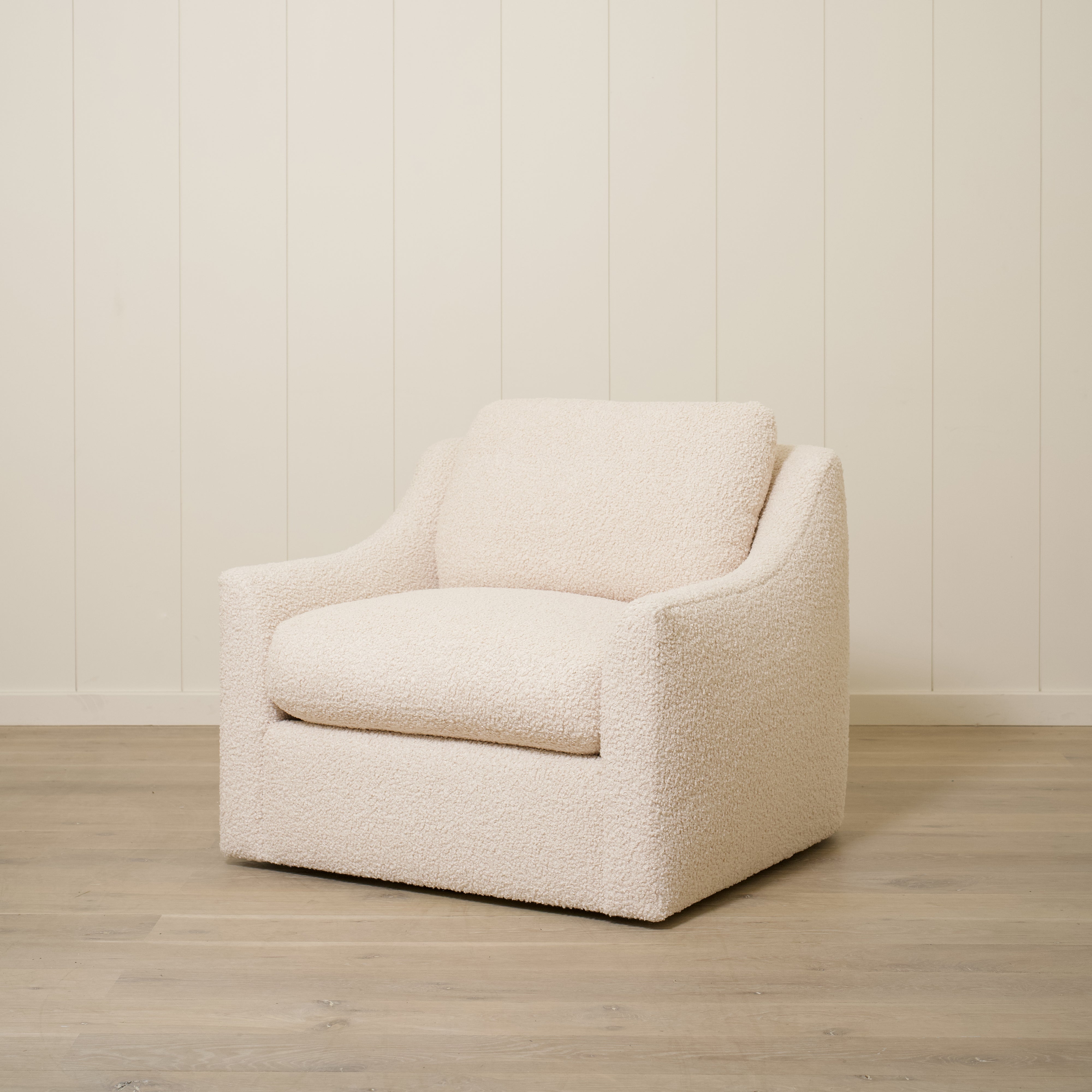 As Shown: Upholstered in Teddy Ivory, swivel.