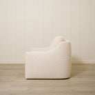 As Shown: Upholstered in Teddy Ivory, swivel.