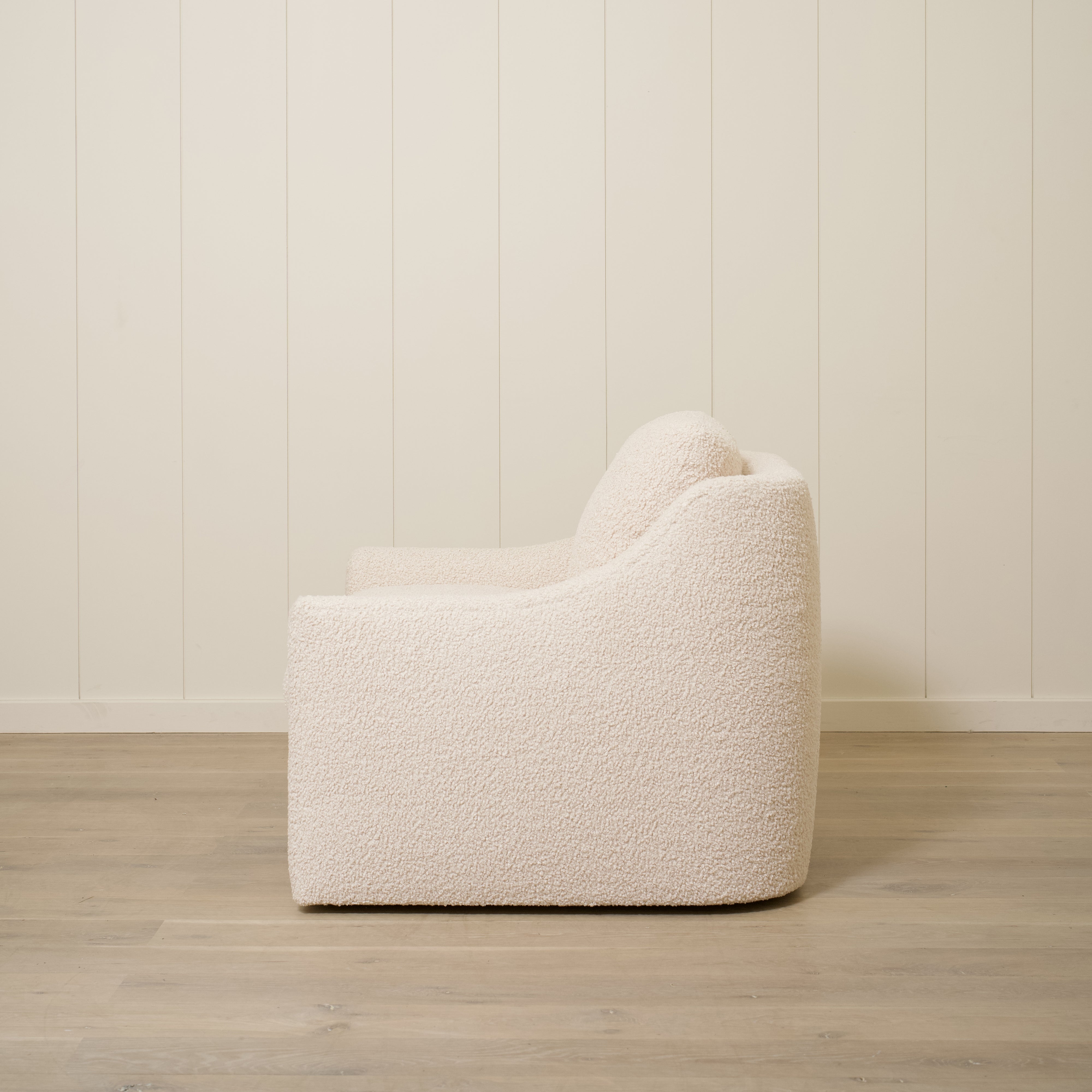 As Shown: Upholstered in Teddy Ivory, swivel.