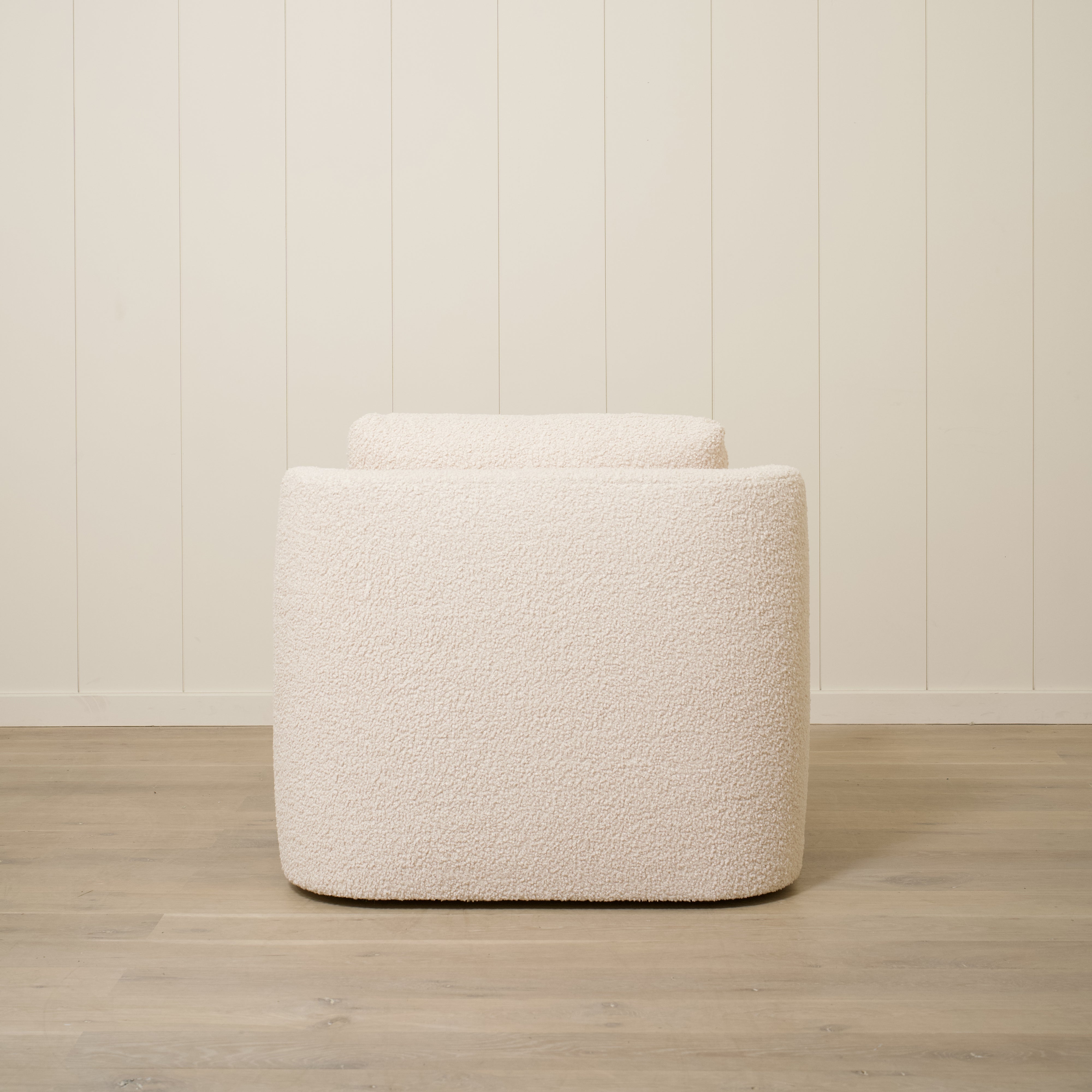 As Shown: Upholstered in Teddy Ivory, swivel.