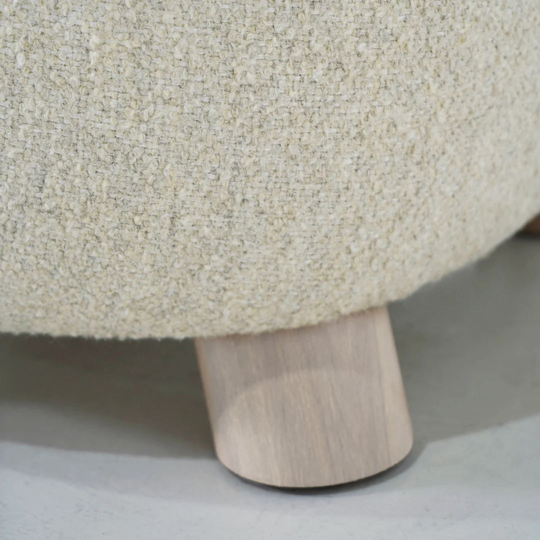 As Shown in Berber Natural, legs finished in Sand.