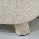 As Shown in Berber Natural, legs finished in Sand.
