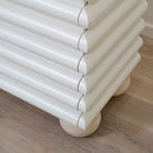 As Shown: Custom Limestone painted EdgeComb Grey, Beige Travertine ball legs