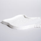 As shown in White Travertine