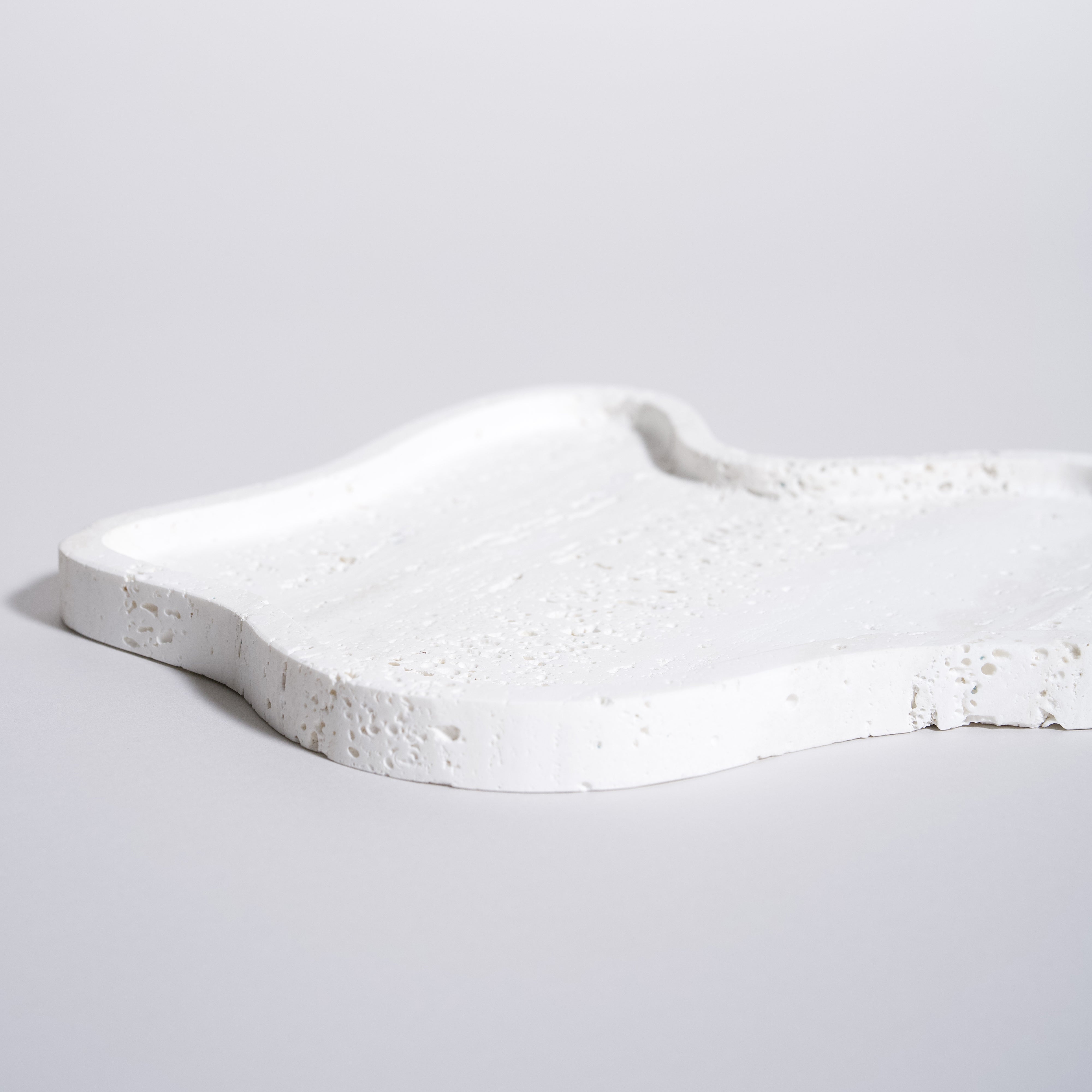 As shown in White Travertine