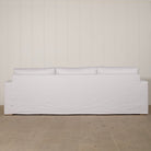 As Shown: slipcovered in COM fabric (Monte White), oak legs finished in Mint White Natural.