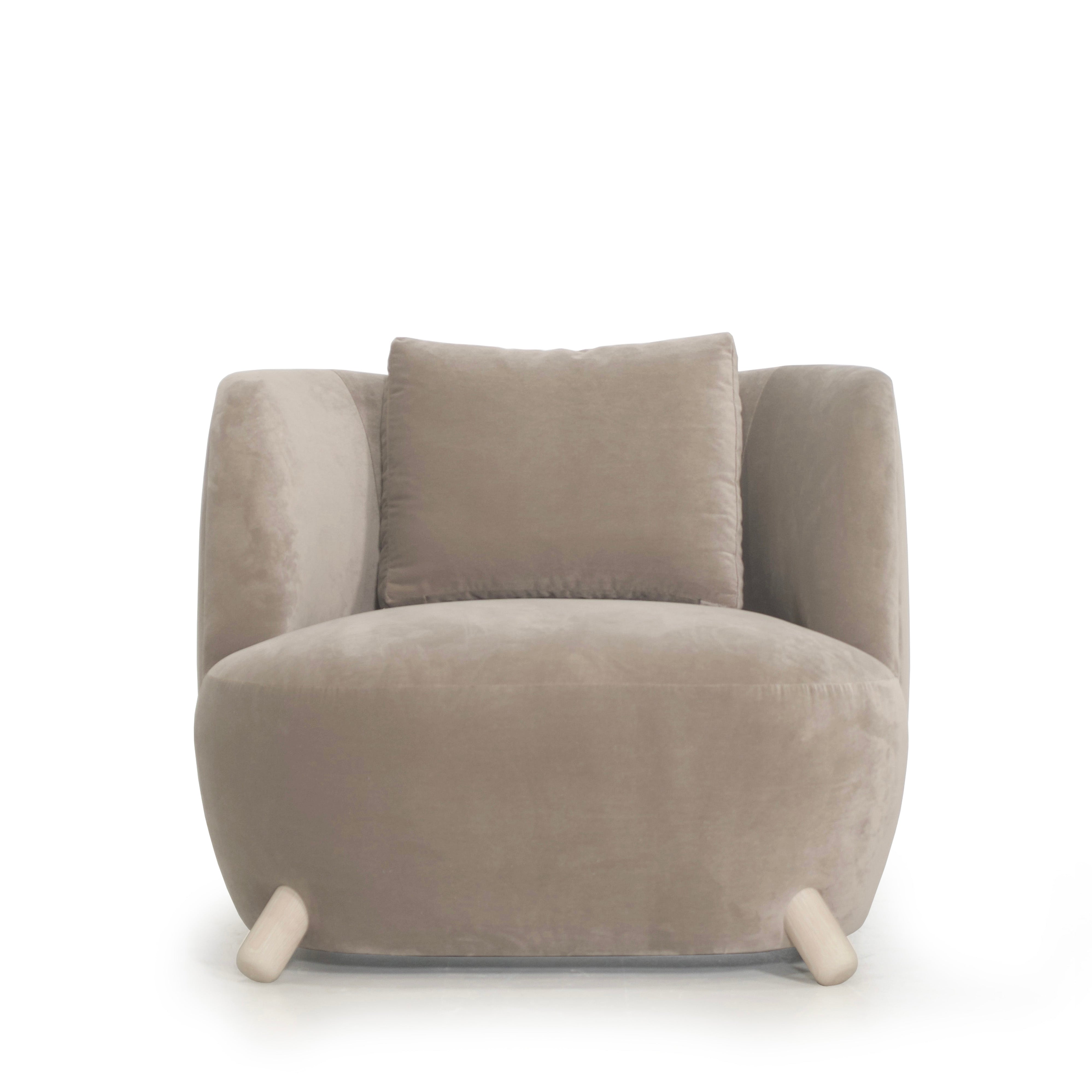 As Shown: in Sky Taupe with oak legs stained in Sand.