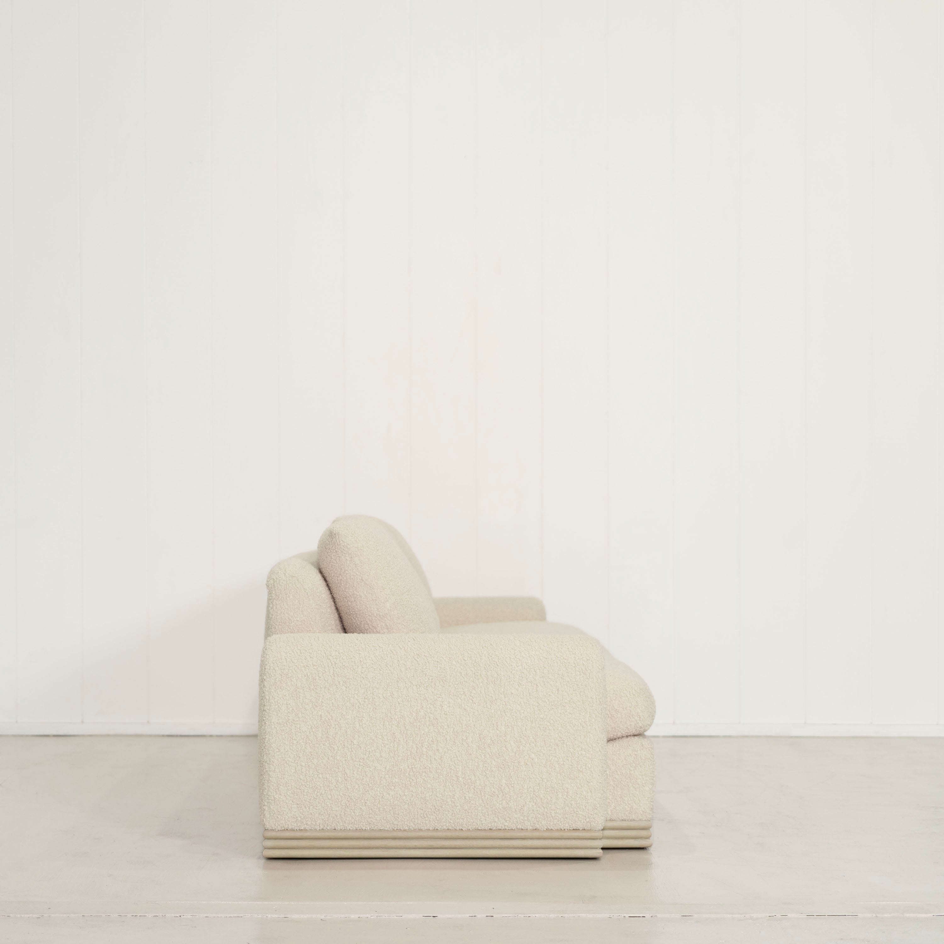 As Shown: Upholstered in Teddy Ivory, oak base finished in Mint White Natural
