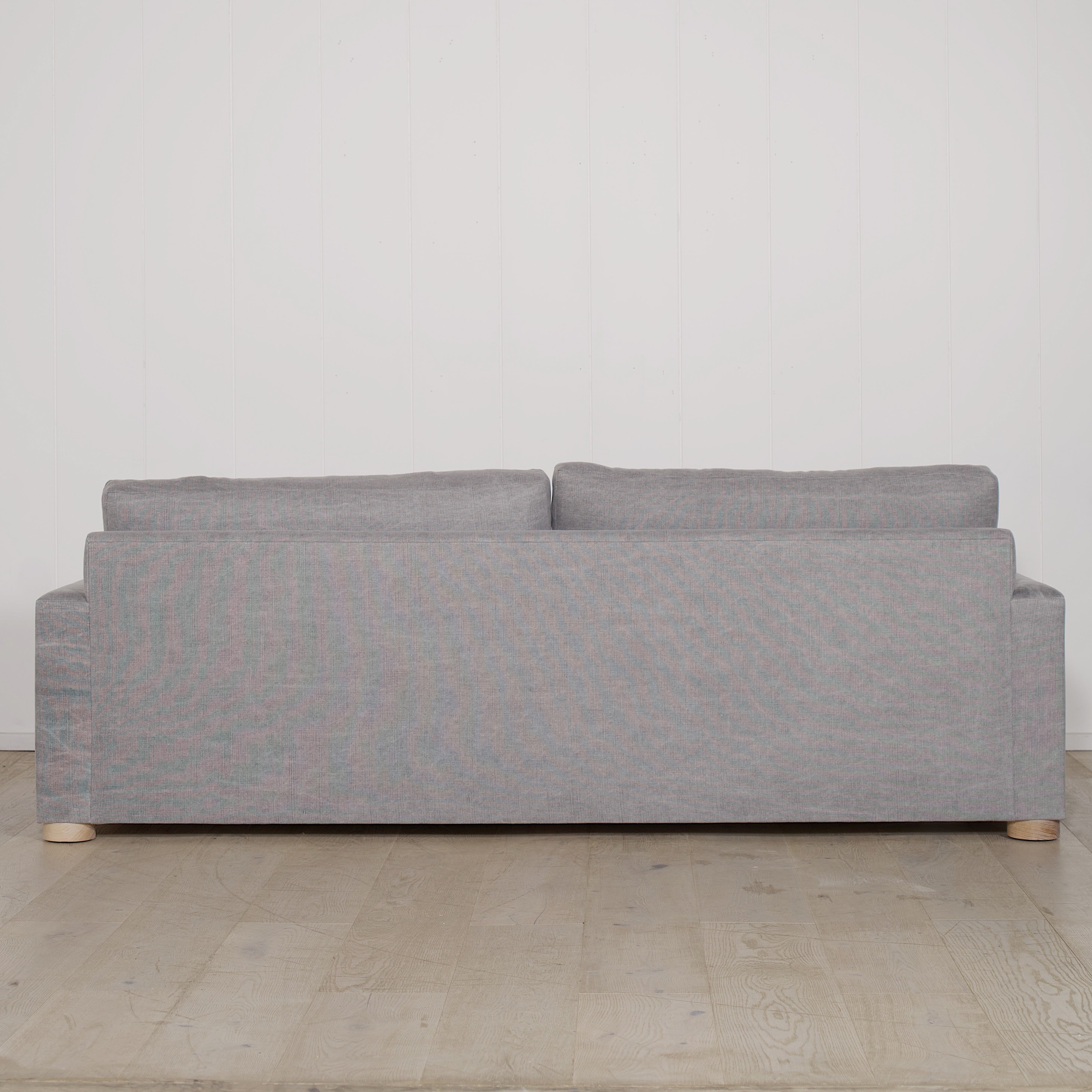 As Shown: in COM fabric, oak legs finished in Mint White Natural.