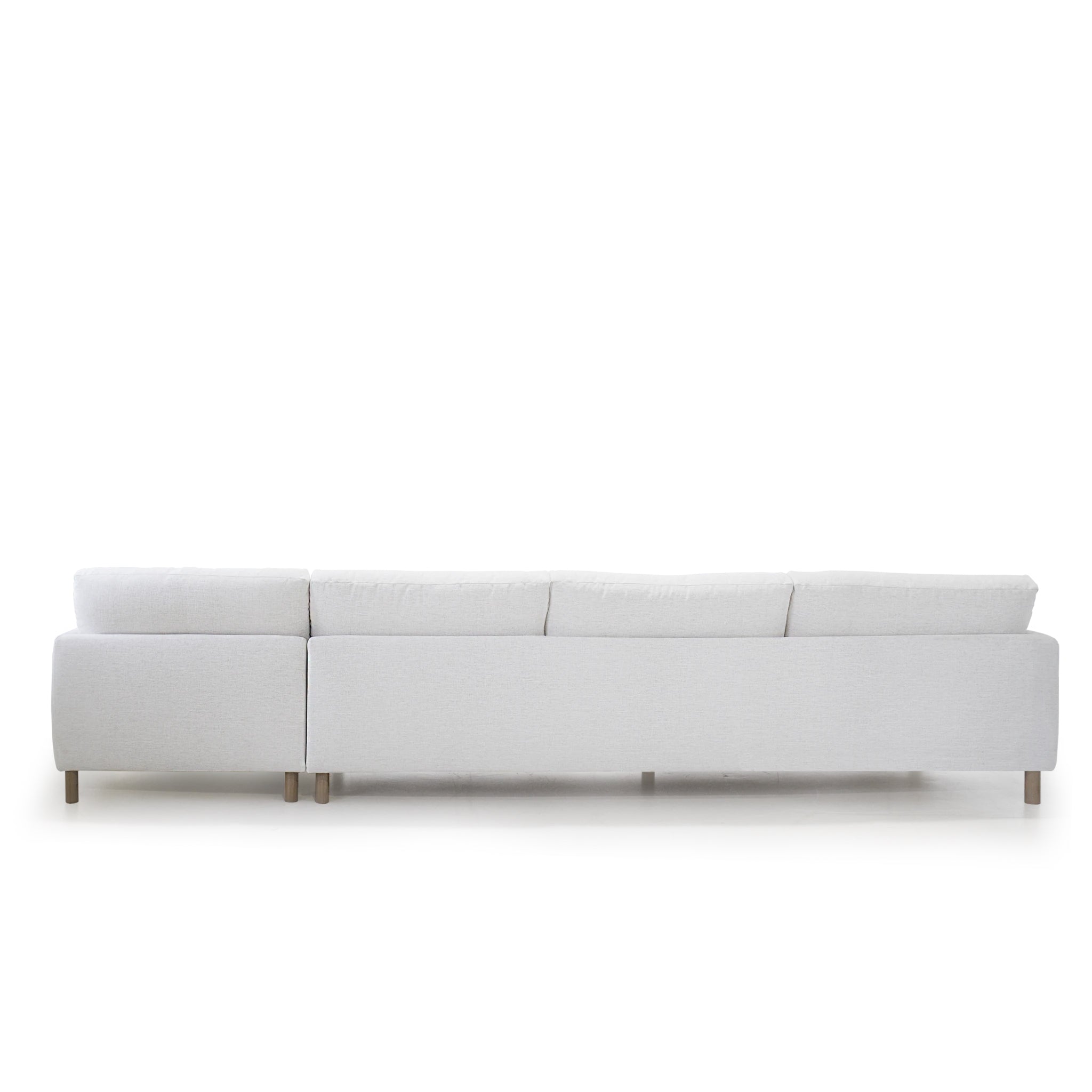 As Shown: in right chaise upholstered in Nomad Snow, oak legs finished in Antique Beige (Discontinued Finish)