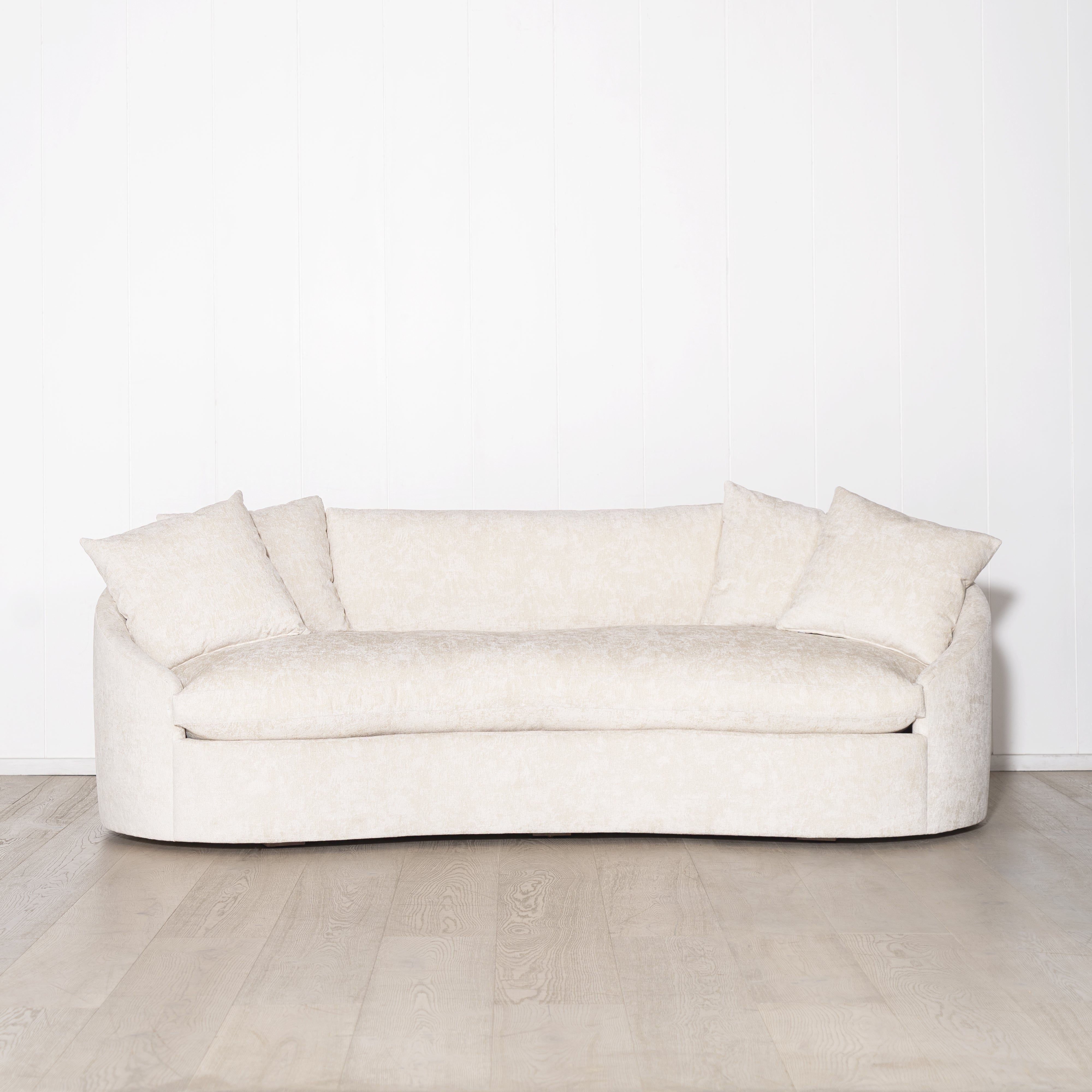 As Shown: in upholstered Zion Custard, oak legs finished in Mint White Natural.