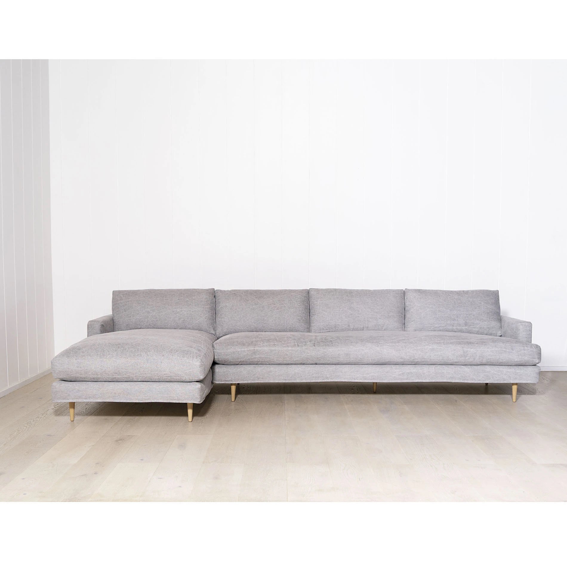 As Shown: Slipcovered in COM. Oak legs finished in Mint White Natural.