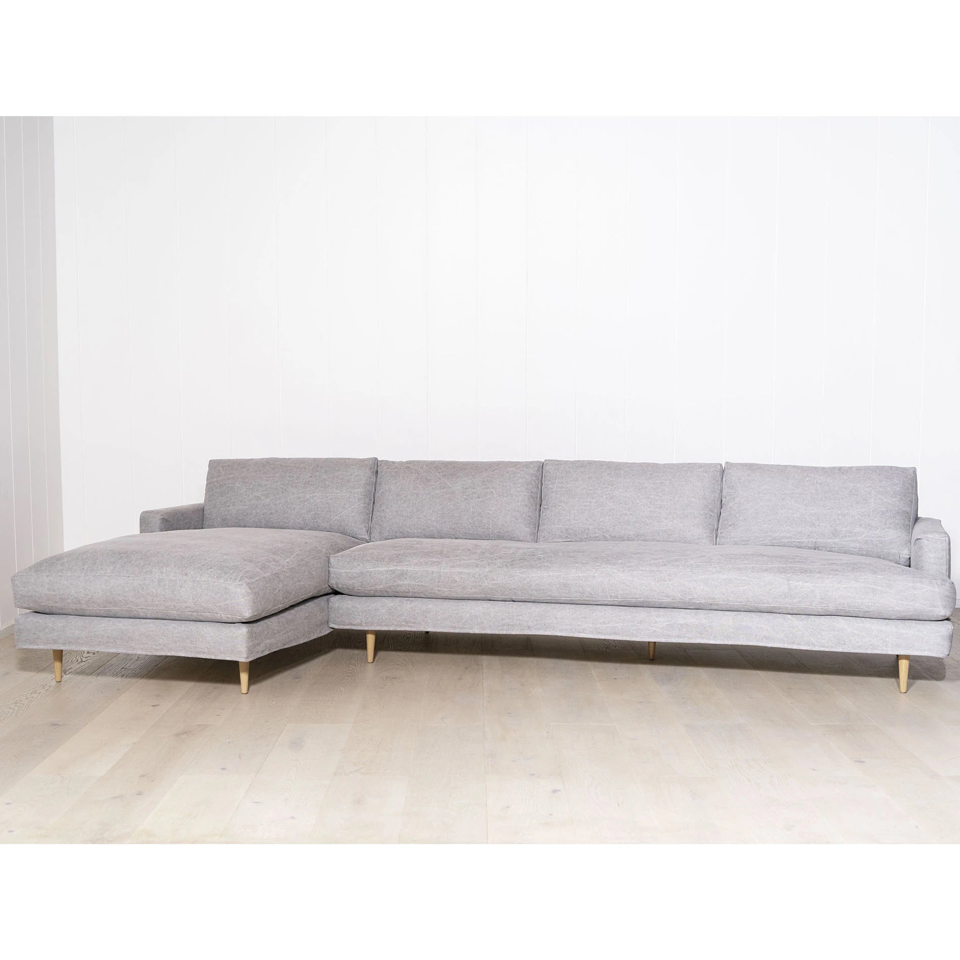 As Shown: Slipcovered in COM. Oak legs finished in Mint White Natural.