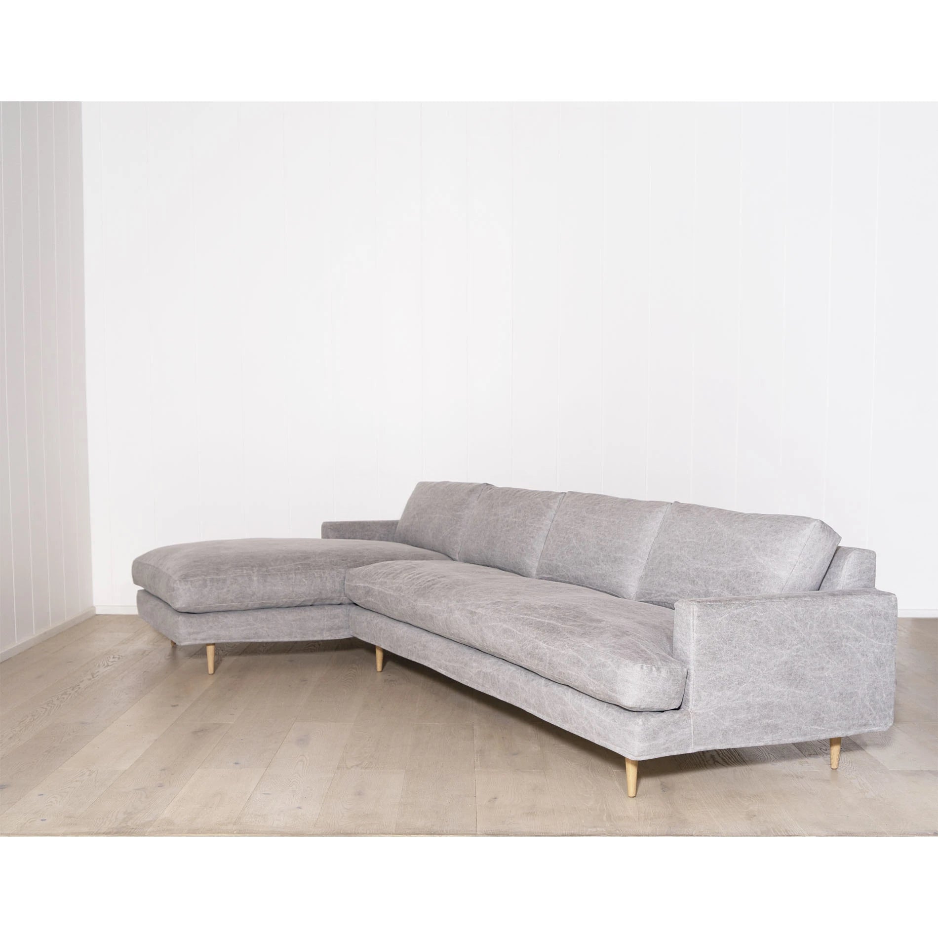As Shown: Slipcovered in COM. Oak legs finished in Mint White Natural.