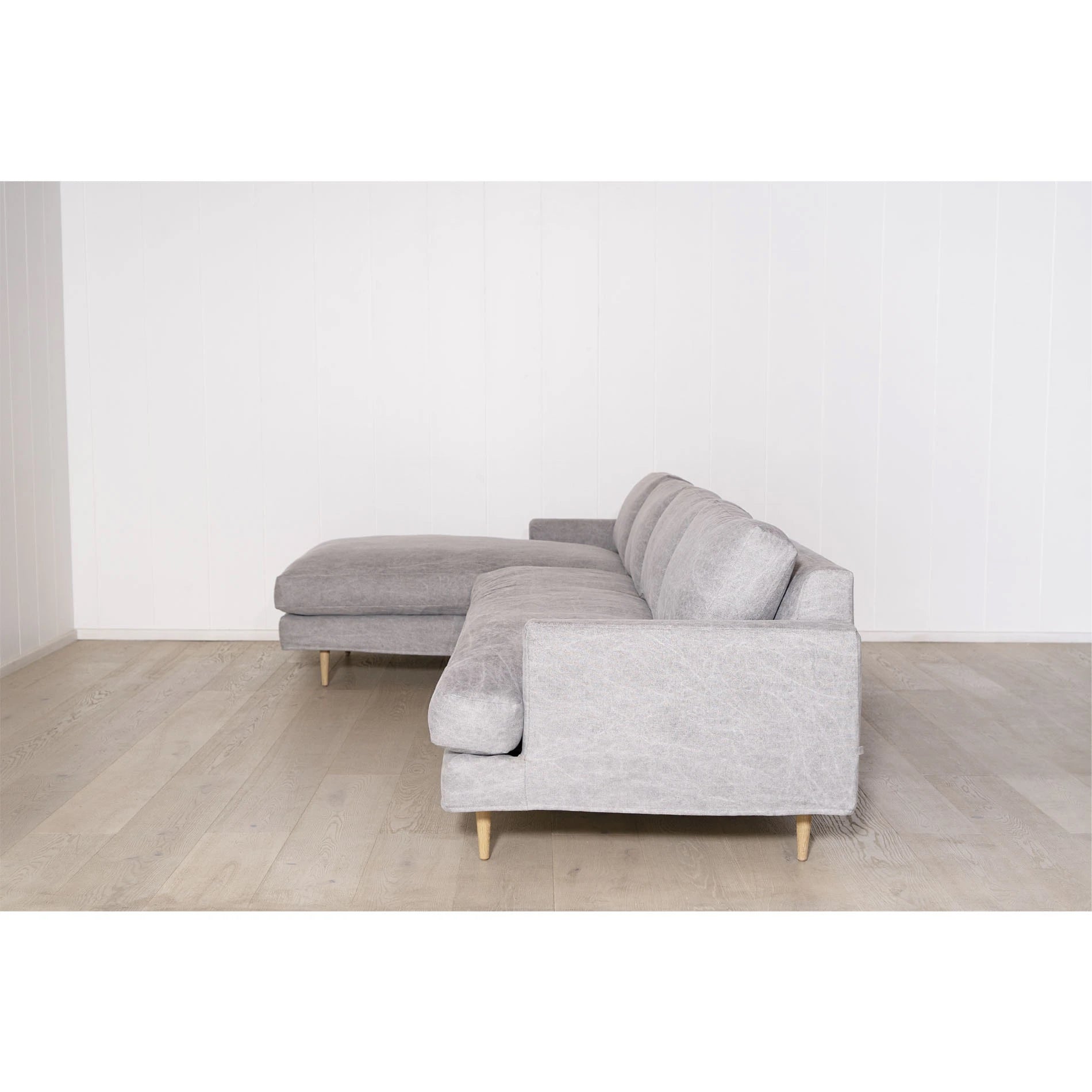 As Shown: Slipcovered in COM. Oak legs finished in Mint White Natural.