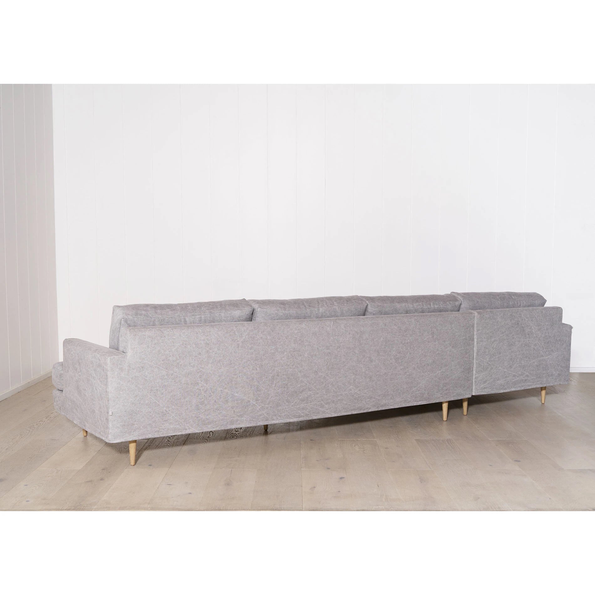 As Shown: Slipcovered in COM. Oak legs finished in Mint White Natural.