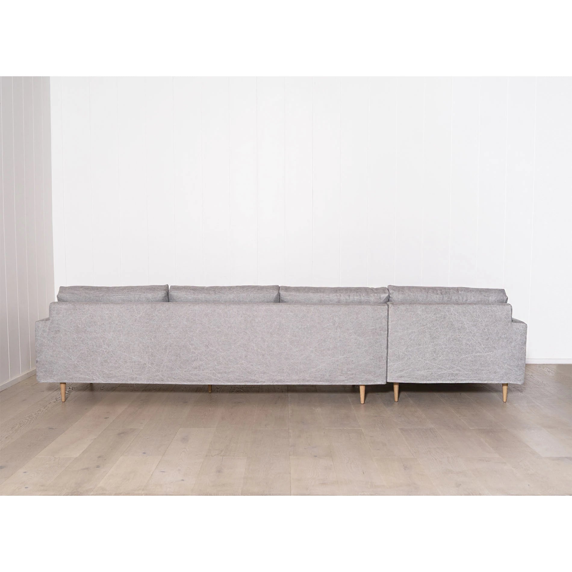 As Shown: Slipcovered in COM. Oak legs finished in Mint White Natural.