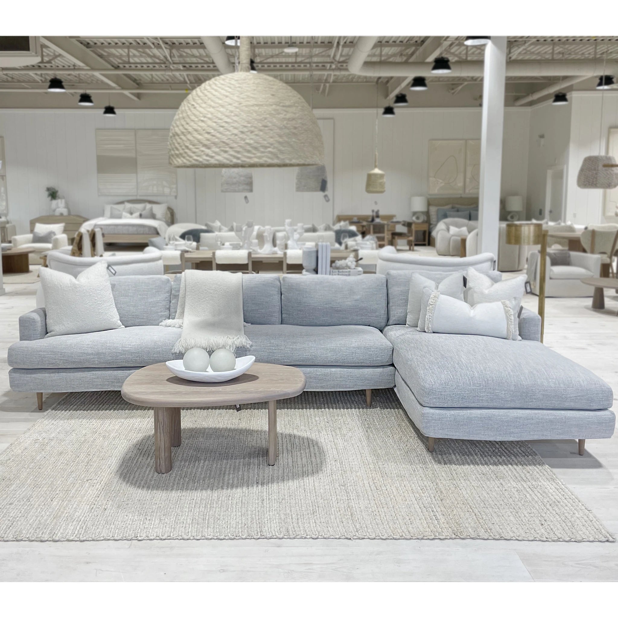As Shown: Slipcovered in COM. Oak legs finished in Mint White Natural.