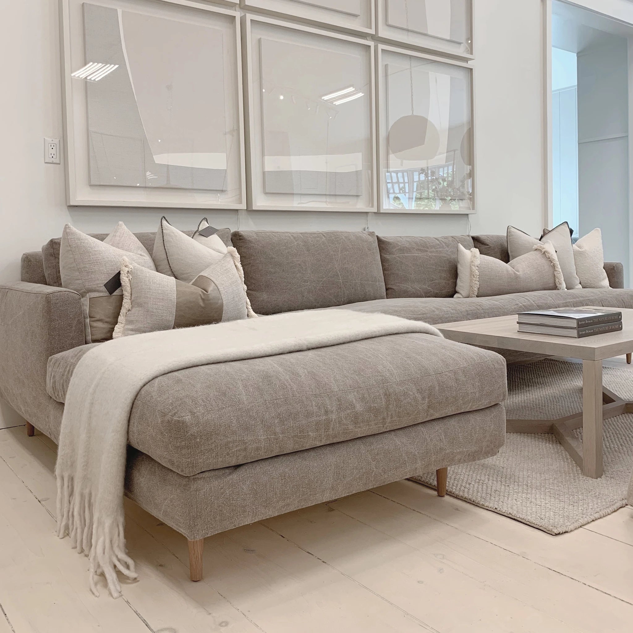 As Shown: Slipcovered in COM. Oak legs finished in Mint White Natural.