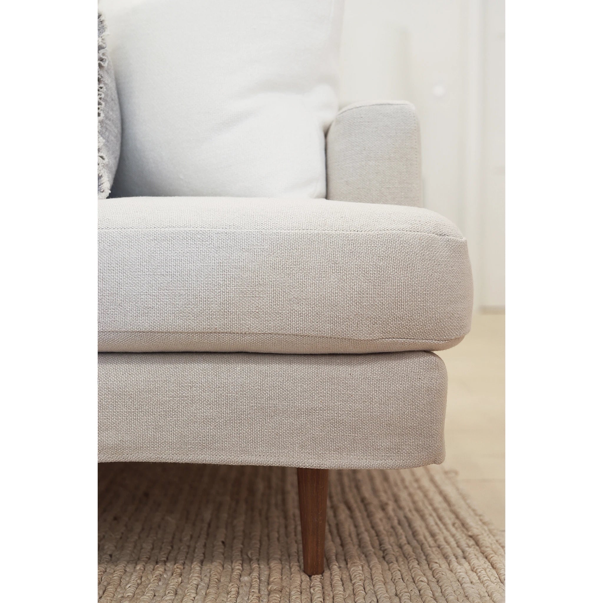 As Shown: Medium, Upholstered in Belgian Oatmeal with legs finished in Mint White Natural.