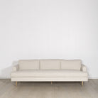 As Shown: Medium, Upholstered in Belgian Oatmeal with legs finished in Mint White Natural.