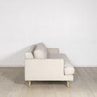 As Shown: Medium, Upholstered in Belgian Oatmeal with legs finished in Mint White Natural.