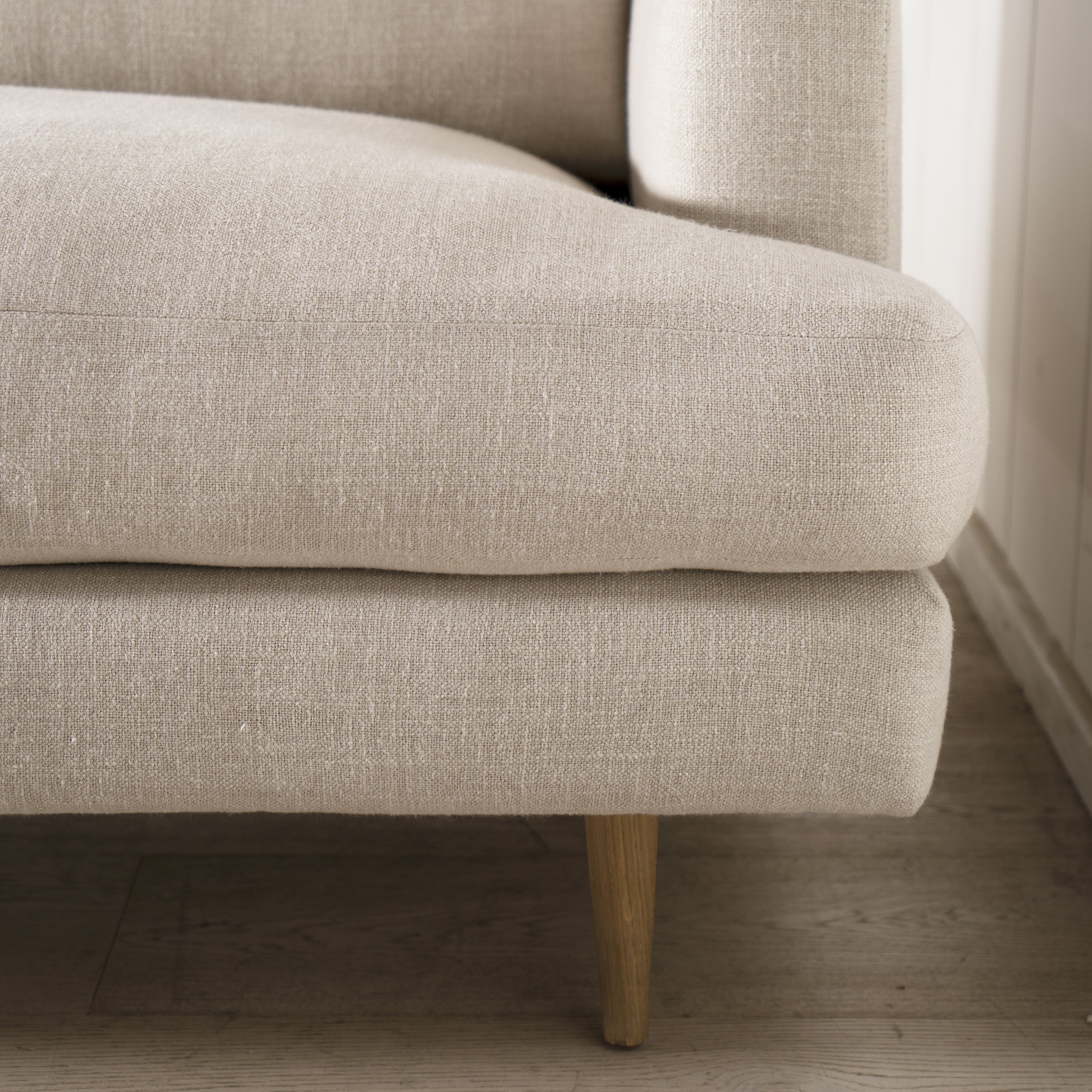 As Shown: Medium, Upholstered in Belgian Oatmeal with legs finished in Mint White Natural.