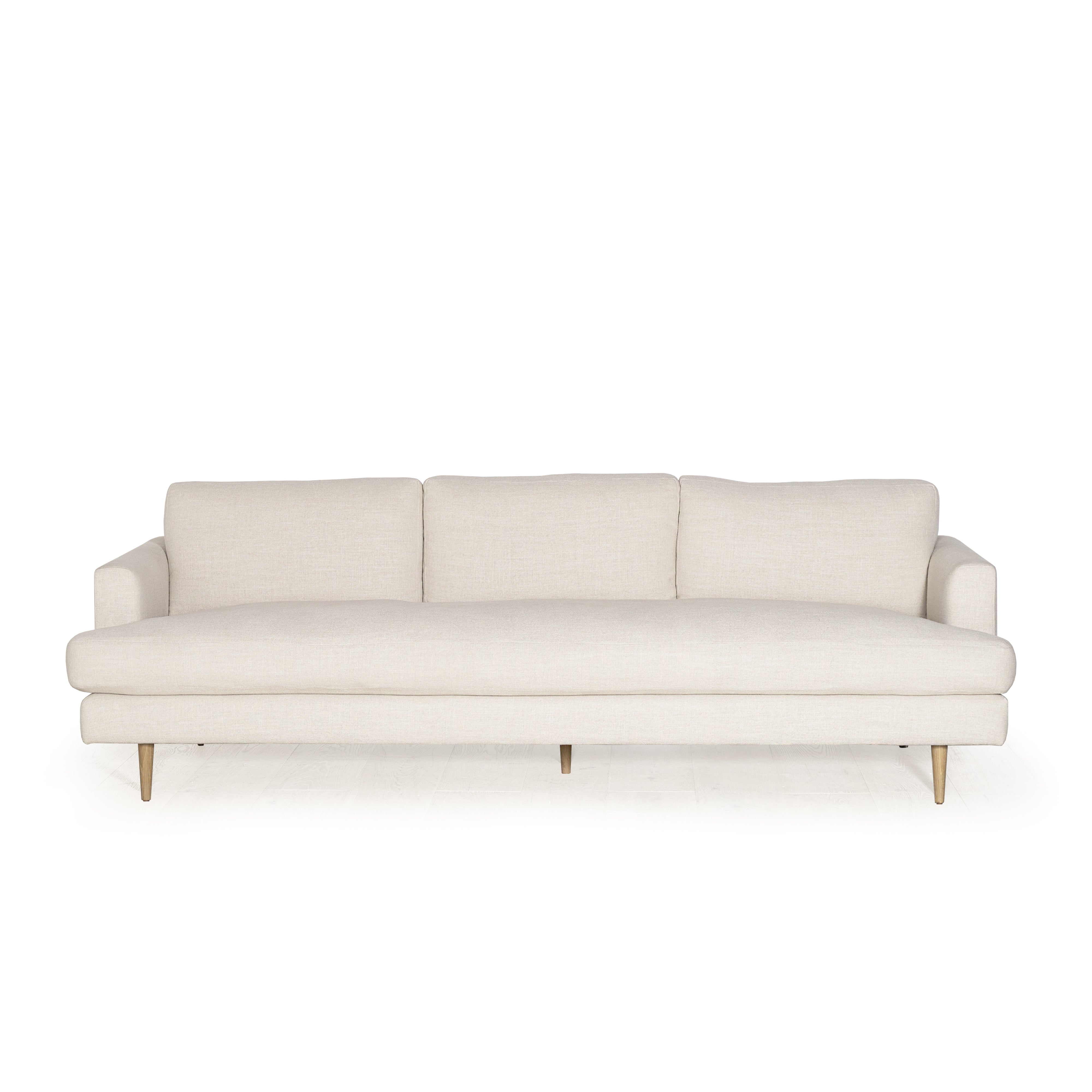 As Shown: Medium, Upholstered in Belgian Oatmeal with legs finished in Mint White Natural.