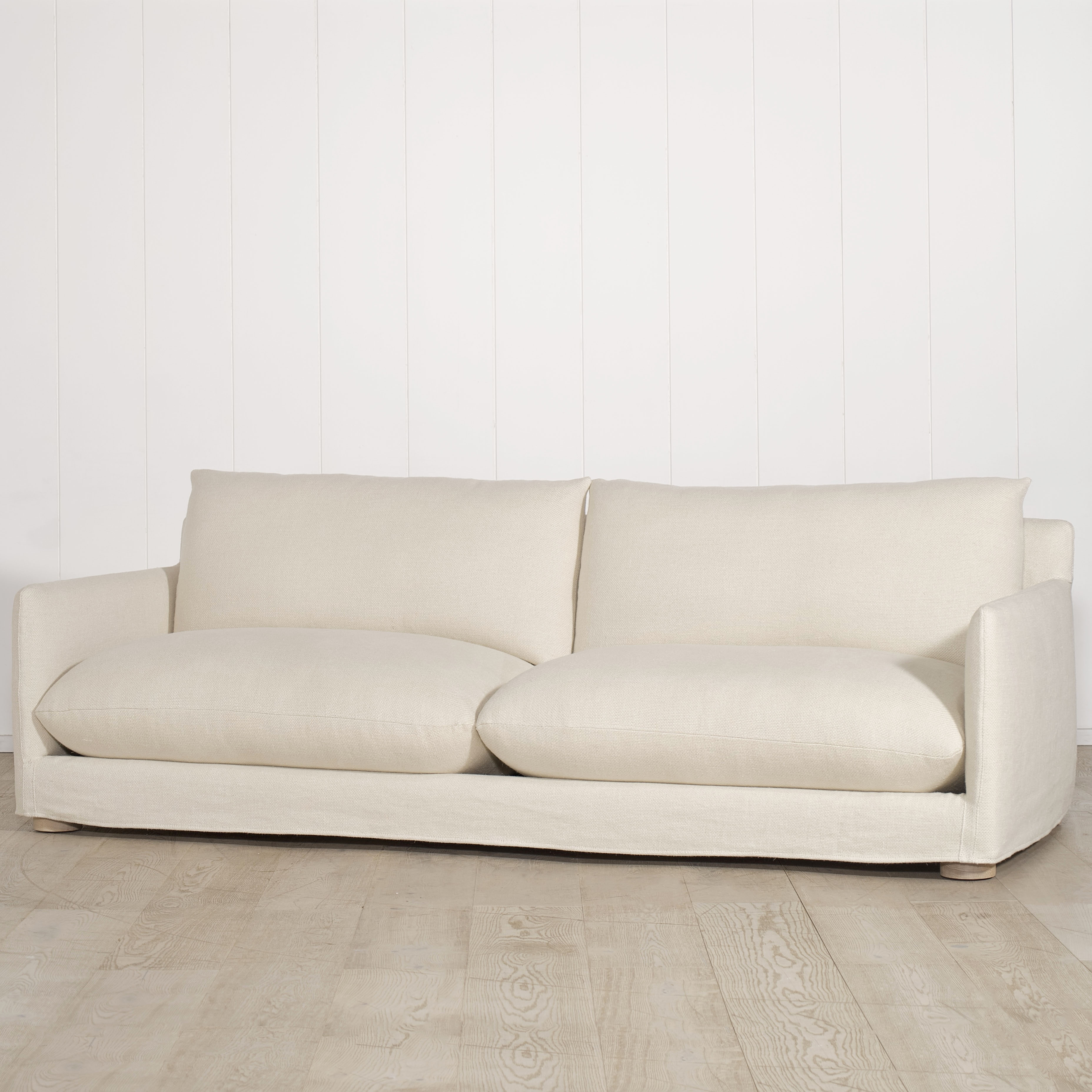 As Shown: Slipcovered in Monte Natural with legs finishing in Mint White Natural