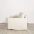 As Shown: Slipcovered in Monte Natural with legs finishing in Mint White Natural