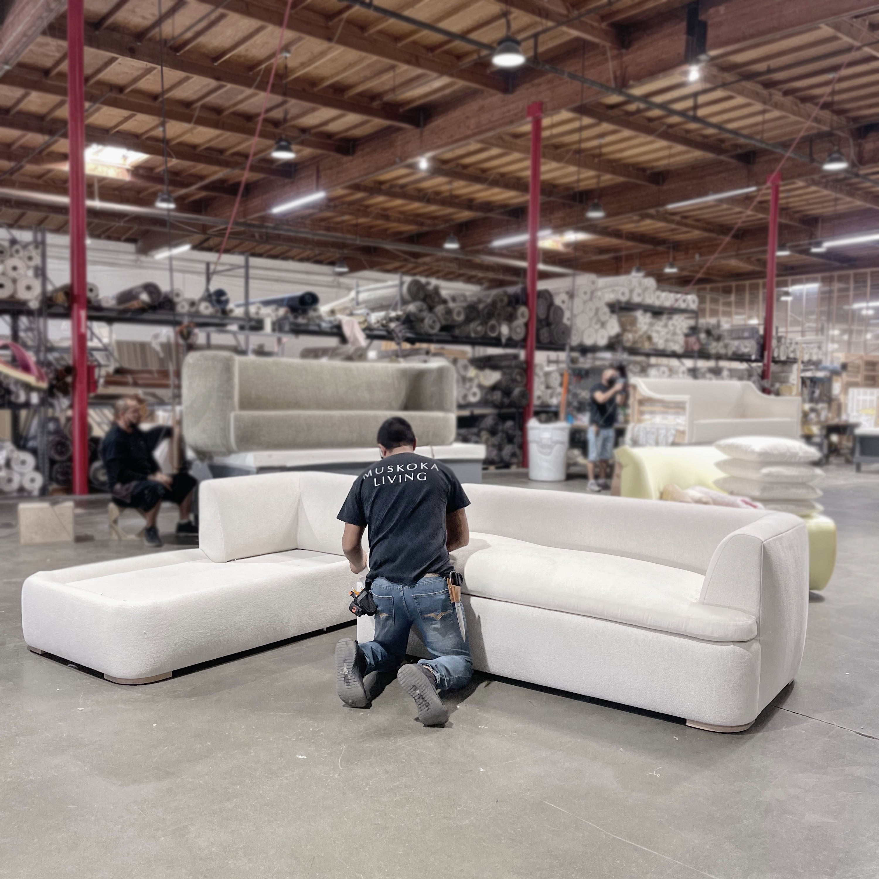 As Shown: Upholstered in COM with Lincoln Parchment seat cushions and pillows. Last variant  in Belgian Sky Blue.Oak legs finished in Mint White Natural.