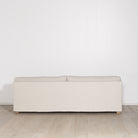 As Shown: in Large, short slipcovered in Fresno Sand, oak legs in custom finish
