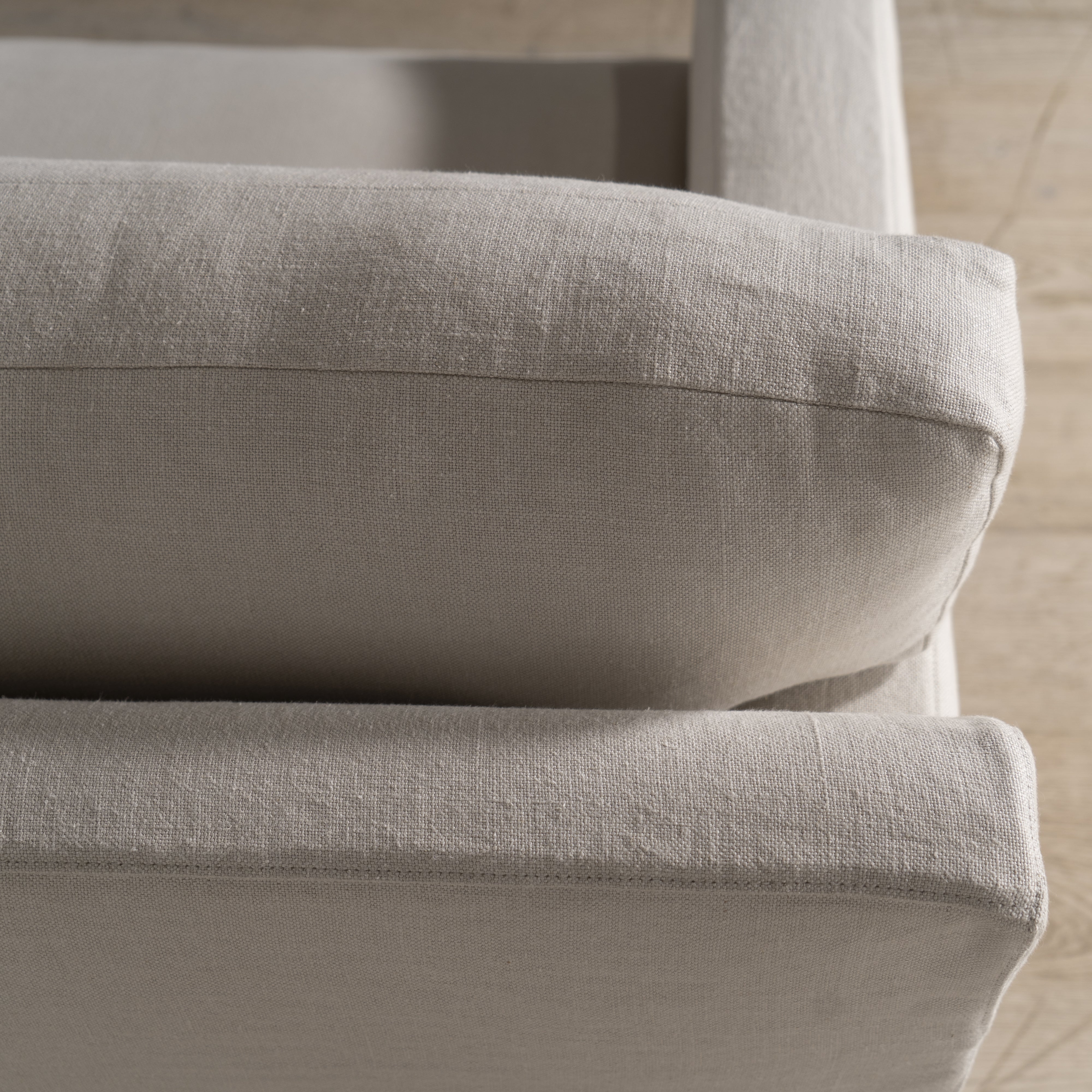 As Shown: in Large, short slipcovered in Fresno Sand, oak legs in custom finish