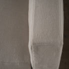 As Shown: in Large, short slipcovered in Fresno Sand, oak legs in custom finish