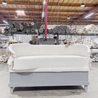 As Shown: in upholstered Zion Custard, oak legs finished in Mint White Natural.
