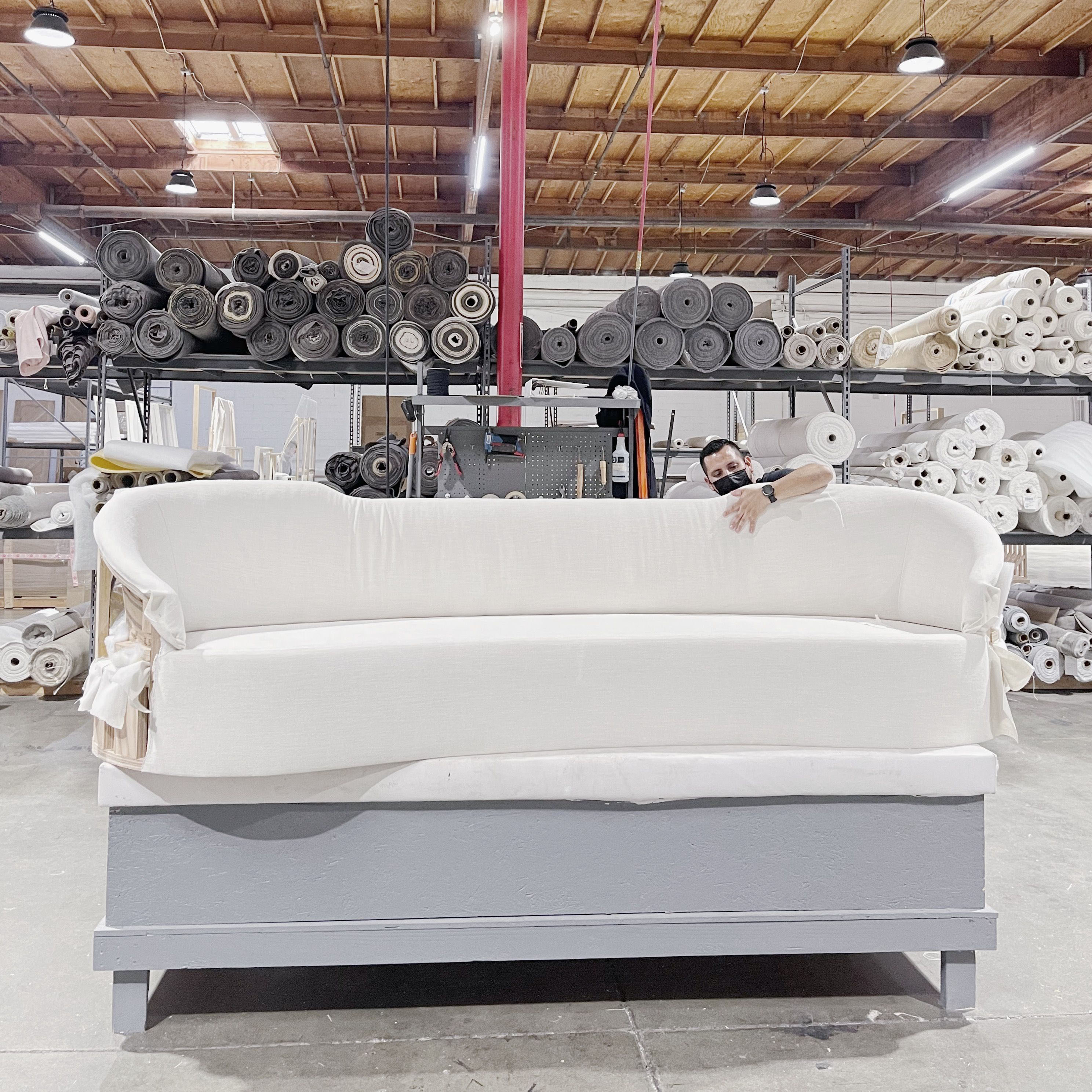 As Shown: in upholstered Zion Custard, oak legs finished in Mint White Natural.